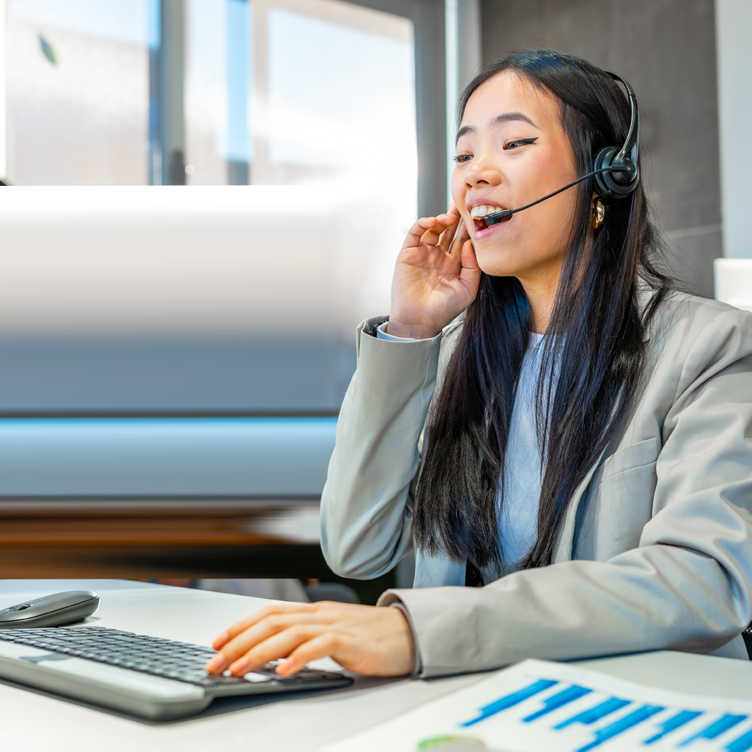 ENVATO_Asian businesswoman working with headset in coworking office By Unai82_SQ1