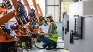 Maintenance engineer worker working with robotic machine automation