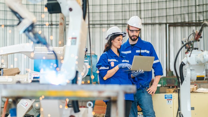 professional technician engineer checking mechanical factory equipment industry machine