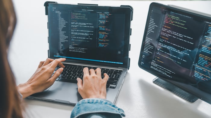 Female programmer working on coding, software development and web design.
