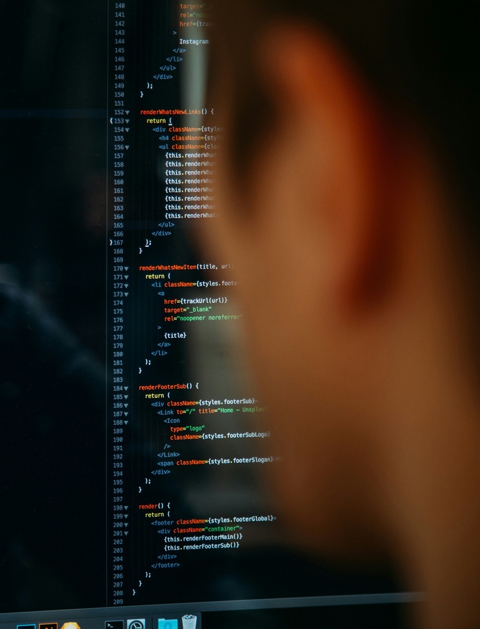 AI engineer -Man looking at code on a screen