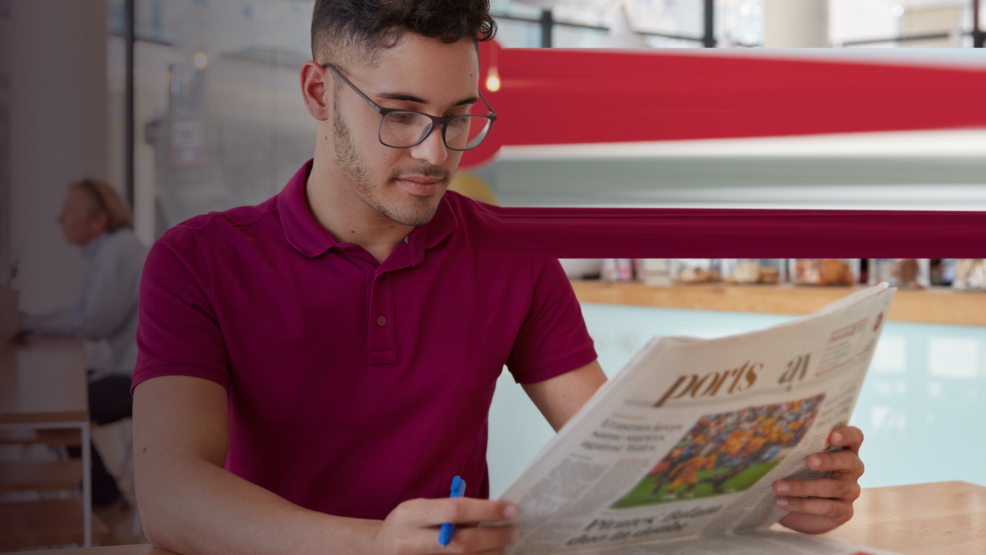 genscom_Image of concentrated man with serious facial expression, reads newspaper, finds out world news, hol By wayhomestudioo_3_evvato