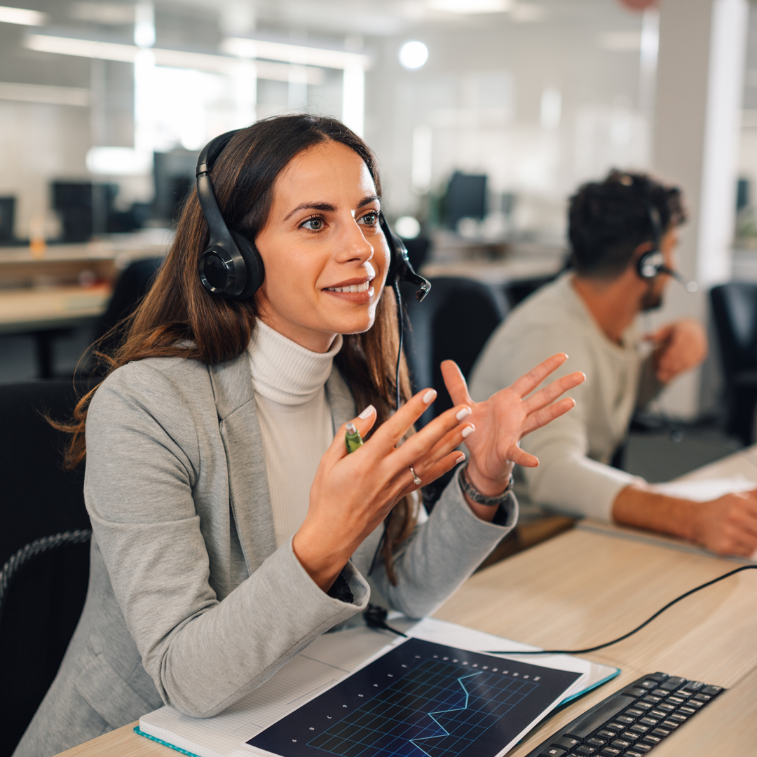 Call center female agent answering incoming calls with a headset