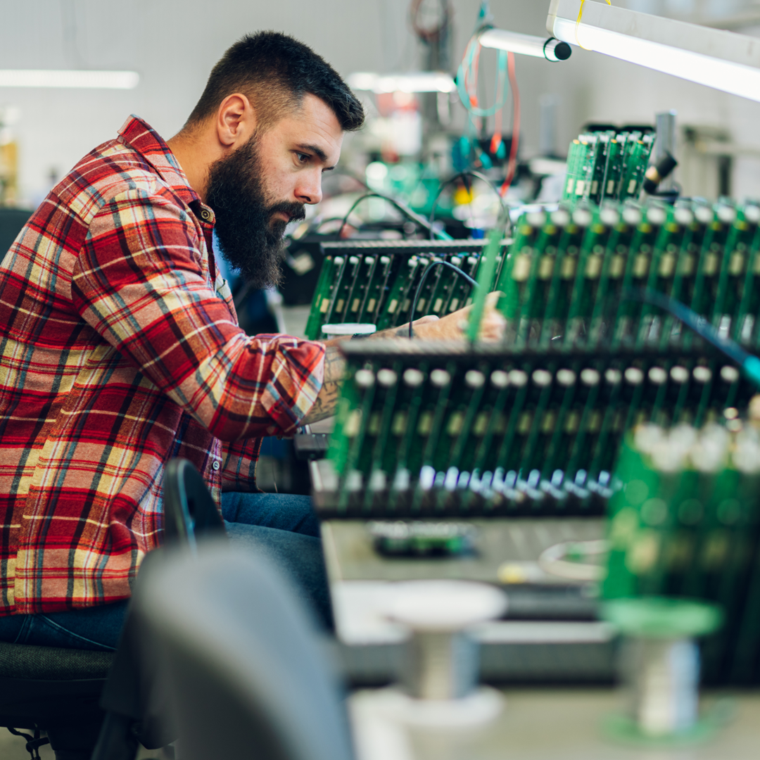 Envato_Electronics engineer working in a workshop with tin soldering parts By zamrznutitonovi_SQ0