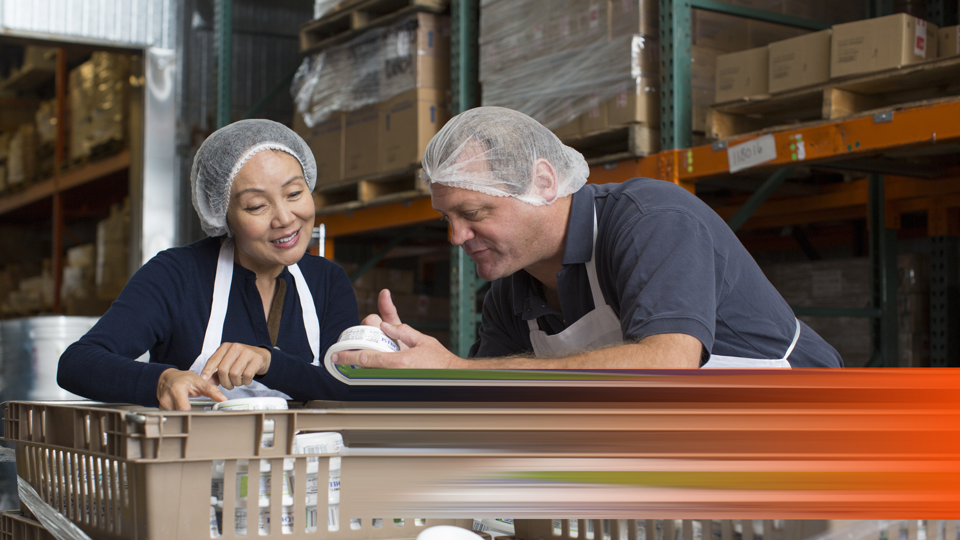 Envato_Factory workers checking products in warehouse By Image-Source_L1