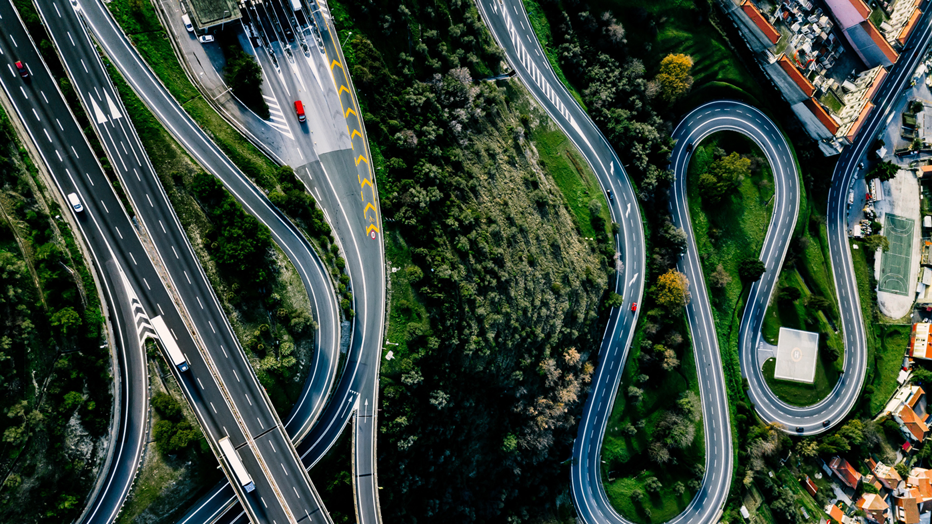 Aerial view of highway, expressway and motorway with a toll payment point in Italy